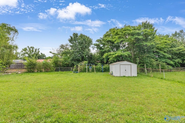3104 Sandlin Rd SW, Decatur, AL 35603 - view of yard with a storage shed, an outbuilding, and a playground