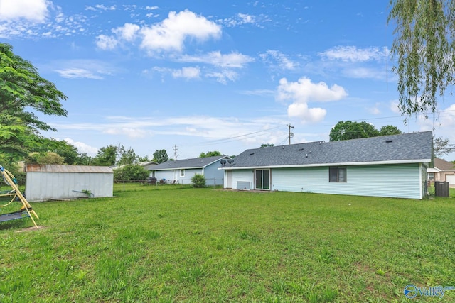 3104 Sandlin Rd SW, Decatur, AL 35603 - rear view of property with cooling unit and an outbuilding