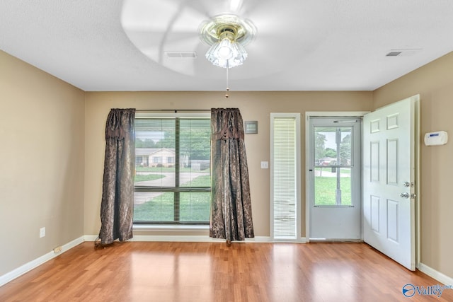 3104 Sandlin Rd SW, Decatur, AL 35603 - foyer entrance featuring ceiling fan, light wood-style flooring, and baseboards