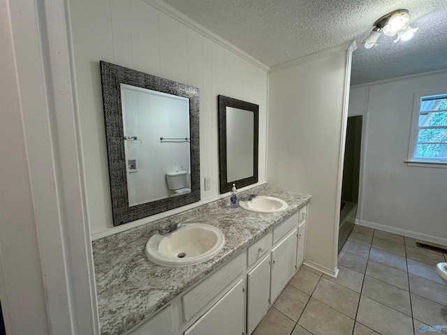 bathroom with toilet, tile patterned flooring, wooden walls, vanity, and a bath