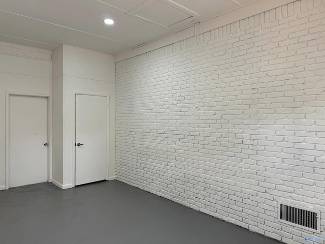 empty room with brick wall