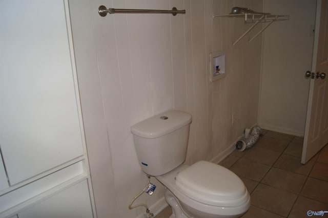 bathroom featuring tile patterned flooring and toilet