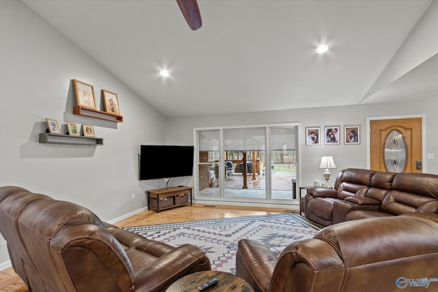 living room featuring hardwood / wood-style floors and vaulted ceiling