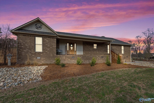 view of front of property with a lawn