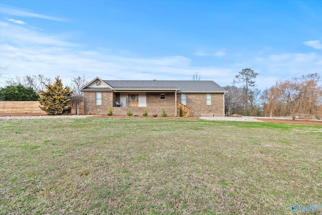 single story home featuring a front yard