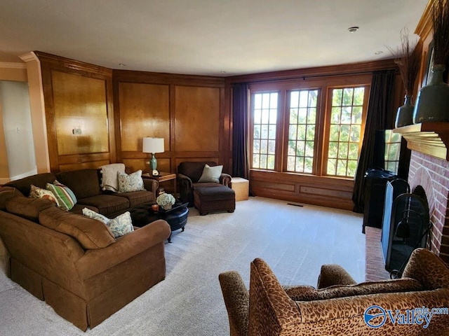 living room with light carpet and a brick fireplace