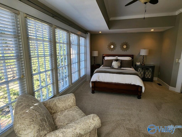 carpeted bedroom featuring ornamental molding and ceiling fan