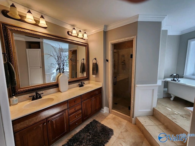 bathroom featuring vanity, ornamental molding, and separate shower and tub