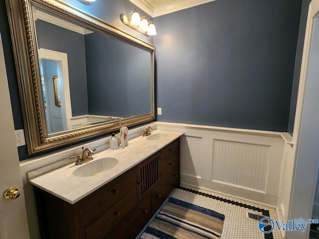 bathroom with vanity and crown molding