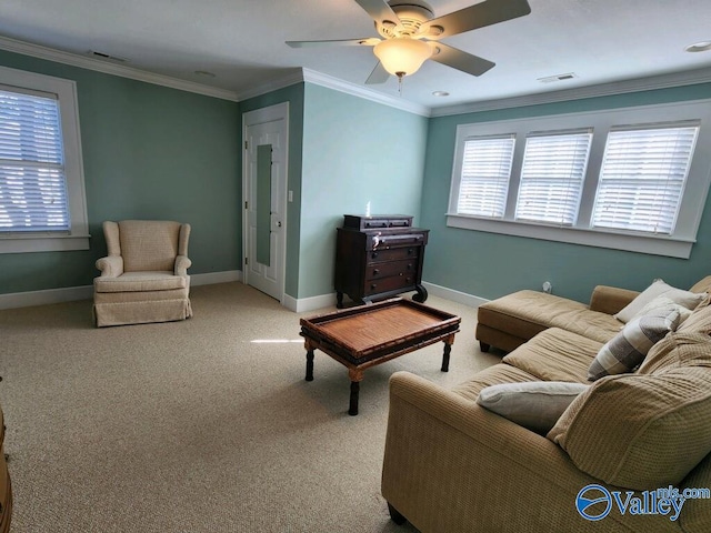 carpeted living room with crown molding, plenty of natural light, and ceiling fan