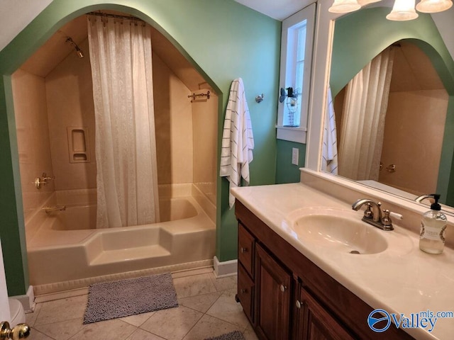 bathroom with vanity, tile patterned flooring, and shower / bath combo with shower curtain