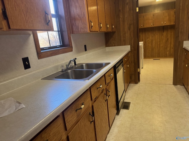 kitchen with black dishwasher and sink