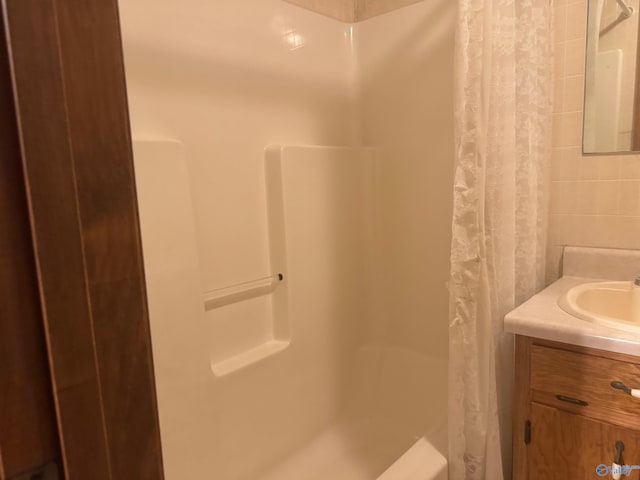 bathroom with vanity and walk in shower