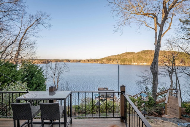 deck featuring a water view