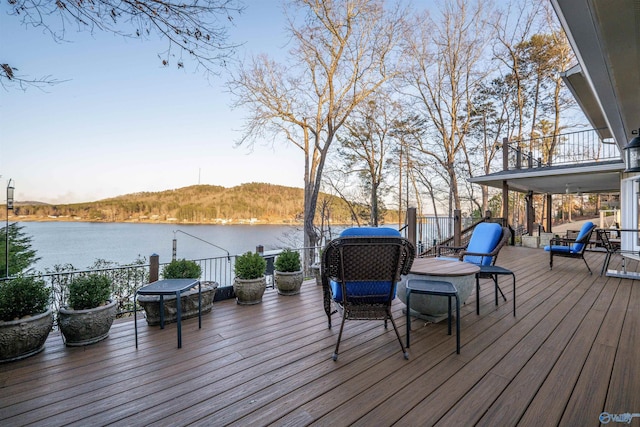 wooden terrace with a water view