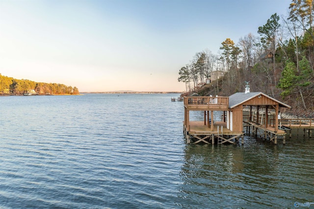 dock area with a water view and boat lift