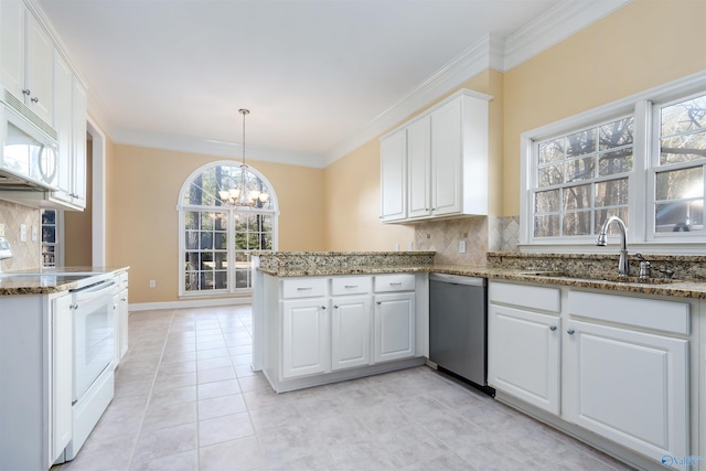 kitchen featuring white appliances, tasteful backsplash, white cabinets, ornamental molding, and a sink