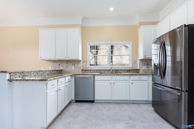 kitchen with dishwasher, dark stone counters, white cabinetry, and stainless steel fridge with ice dispenser