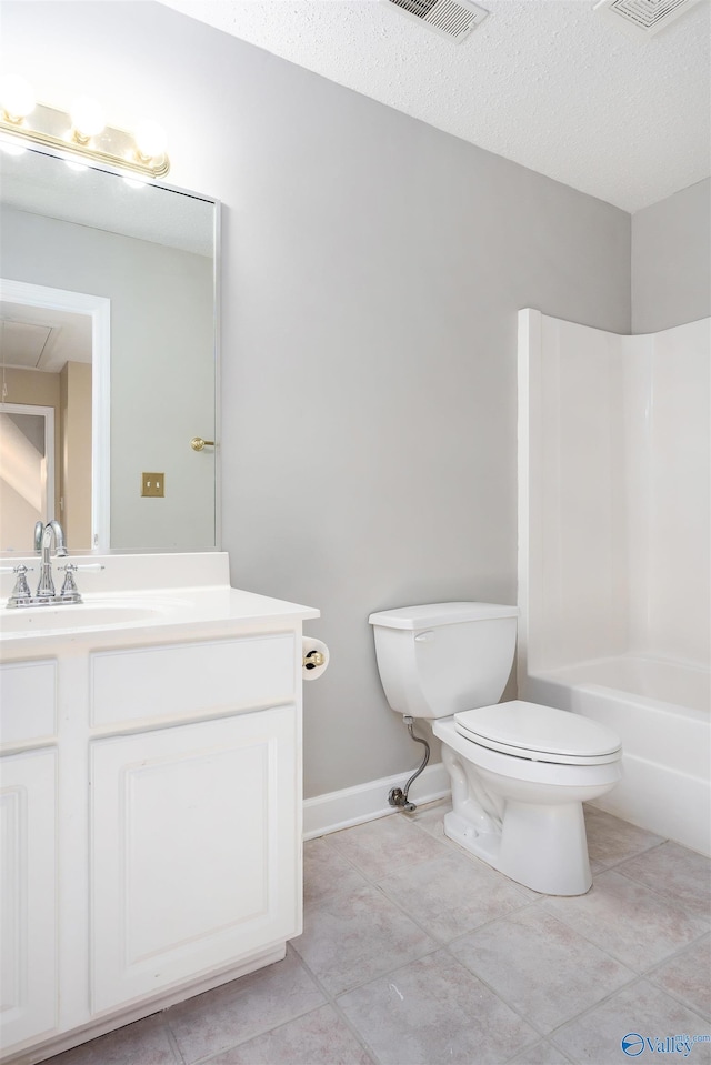 bathroom with toilet, tile patterned floors, and vanity