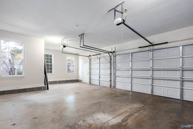 garage featuring baseboards and a garage door opener