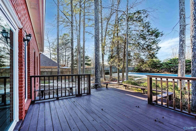 deck with a fenced backyard