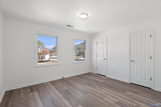 unfurnished bedroom with light wood-type flooring