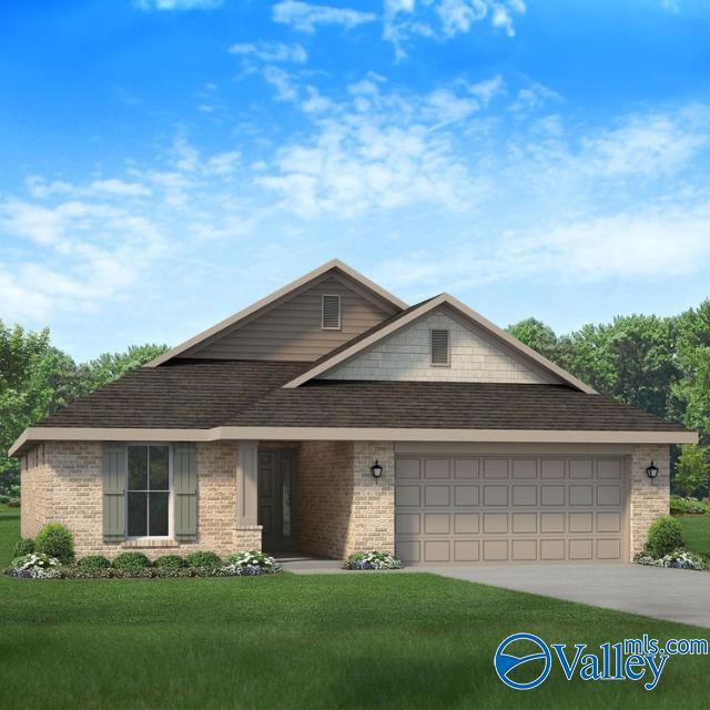 view of front of property featuring brick siding, roof with shingles, an attached garage, a front yard, and driveway