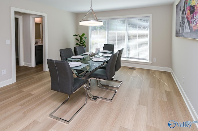 dining space featuring light hardwood / wood-style floors