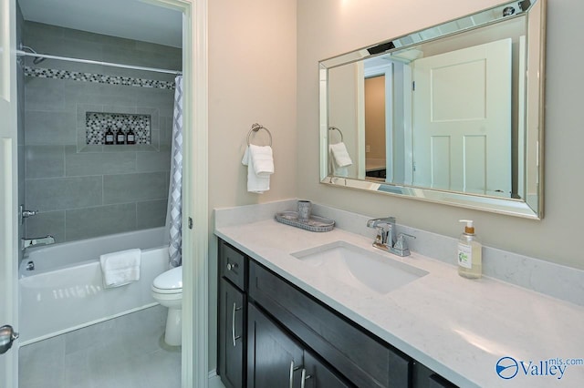 full bathroom featuring vanity, toilet, and shower / bath combo with shower curtain