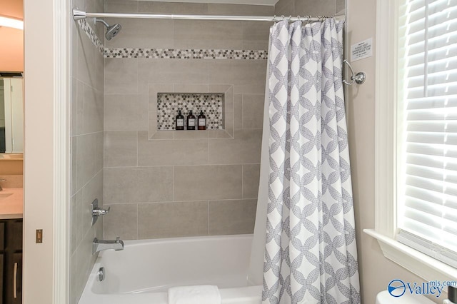 bathroom with shower / bathtub combination with curtain