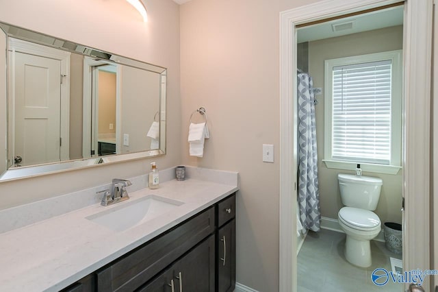 bathroom with vanity and toilet