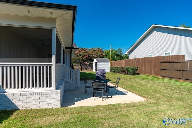 view of yard featuring a patio area and a storage shed