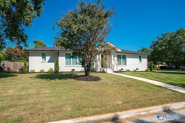 ranch-style home with a front yard