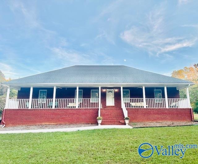 173 N Seneca Dr, Trinity, AL 35673 - single story home with covered porch and a front lawn