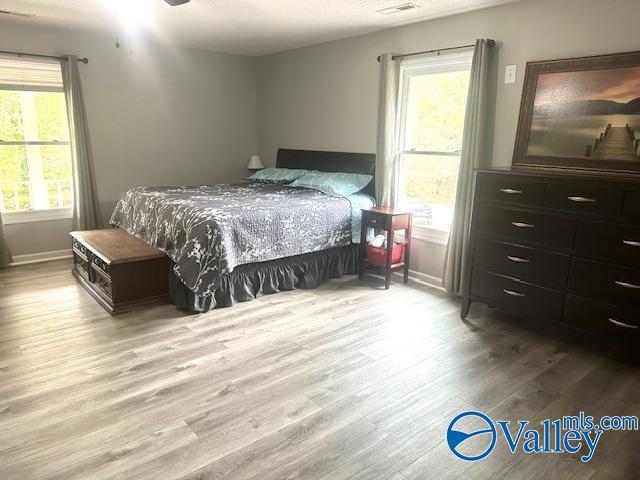 173 N Seneca Dr, Trinity, AL 35673 - bedroom featuring wood finished floors and baseboards