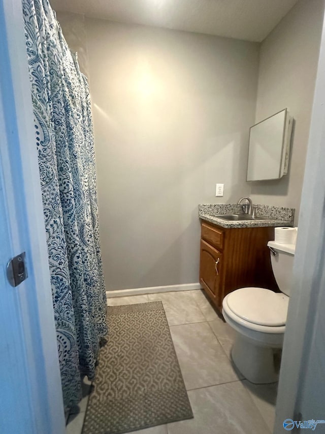173 N Seneca Dr, Trinity, AL 35673 - full bath featuring toilet, vanity, tile patterned flooring, baseboards, and a shower with curtain