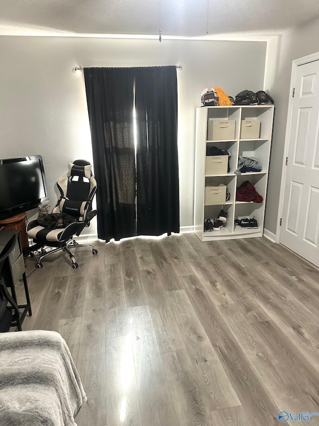 173 N Seneca Dr, Trinity, AL 35673 - bedroom with wood finished floors and a desk