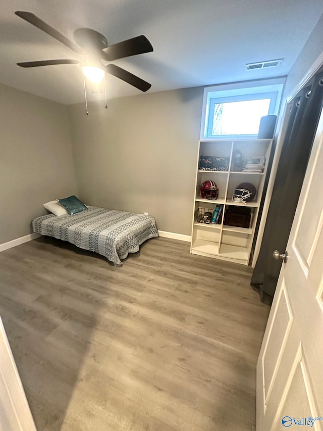 173 N Seneca Dr, Trinity, AL 35673 - bedroom featuring wood finished floors, baseboards, and ceiling fan