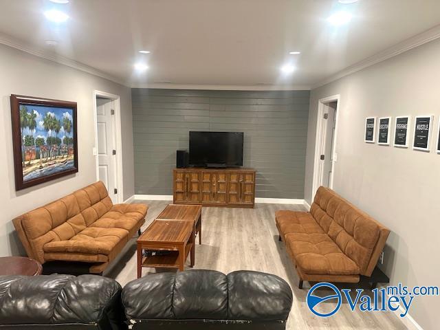 173 N Seneca Dr, Trinity, AL 35673 - living area with wood finished floors, baseboards, recessed lighting, and ornamental molding
