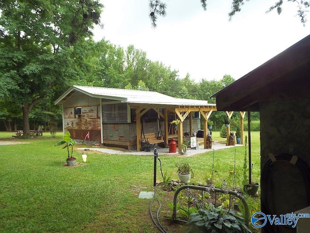 rear view of house featuring a lawn