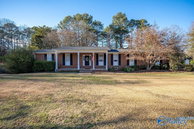 ranch-style home featuring a front yard and a porch