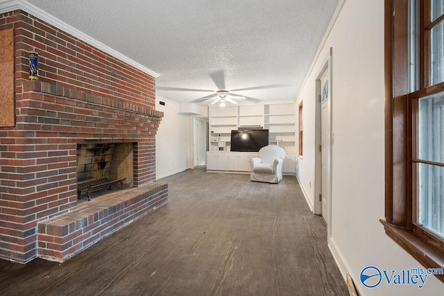 unfurnished living room featuring a textured ceiling, ceiling fan, ornamental molding, and built in shelves