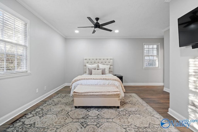 bedroom with ceiling fan, ornamental molding, and dark hardwood / wood-style flooring