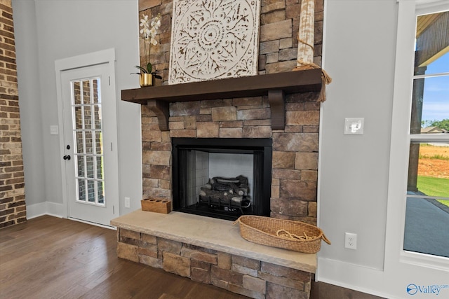 22692 Gunner Cir, Athens, AL 35613 - detailed view of wood finished floors, baseboards, and a fireplace