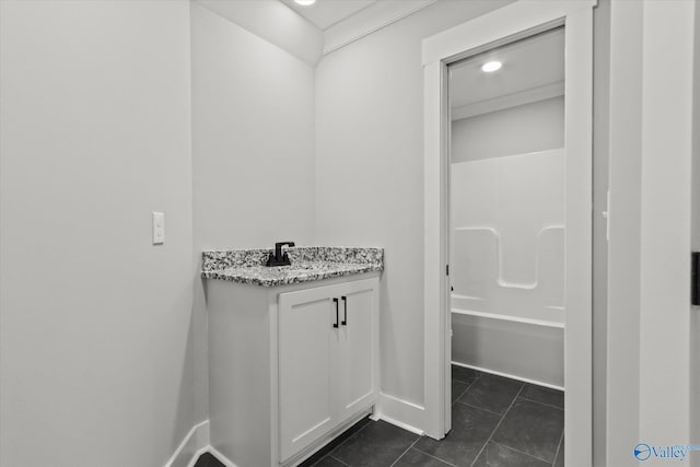 22692 Gunner Cir, Athens, AL 35613 - full bathroom featuring tile patterned flooring, vanity, bathtub / shower combination, and baseboards