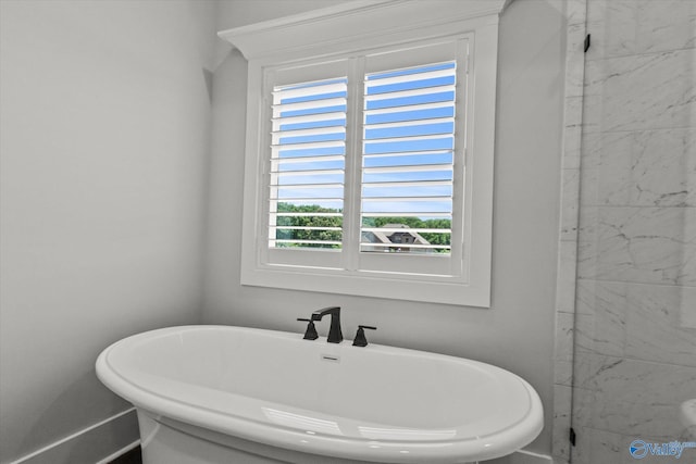 22692 Gunner Cir, Athens, AL 35613 - full bath featuring a freestanding tub and baseboards