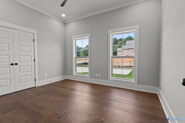 22692 Gunner Cir, Athens, AL 35613 - empty room with dark wood-style flooring, crown molding, a ceiling fan, and baseboards