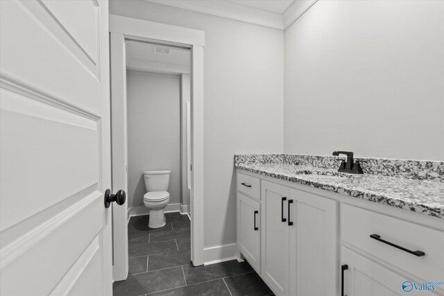 22692 Gunner Cir, Athens, AL 35613 - bathroom featuring vanity, toilet, and tile patterned floors