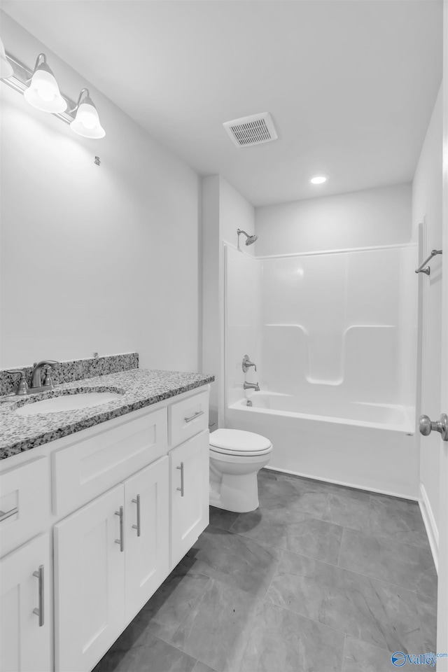 full bathroom with toilet, washtub / shower combination, visible vents, and vanity