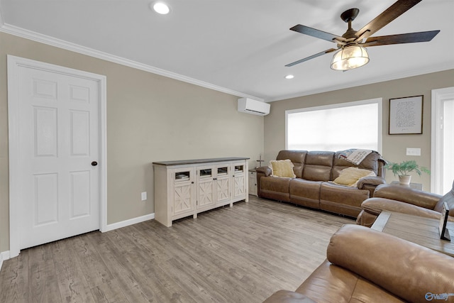 living room with ceiling fan, ornamental molding, a wall mounted AC, and light hardwood / wood-style floors